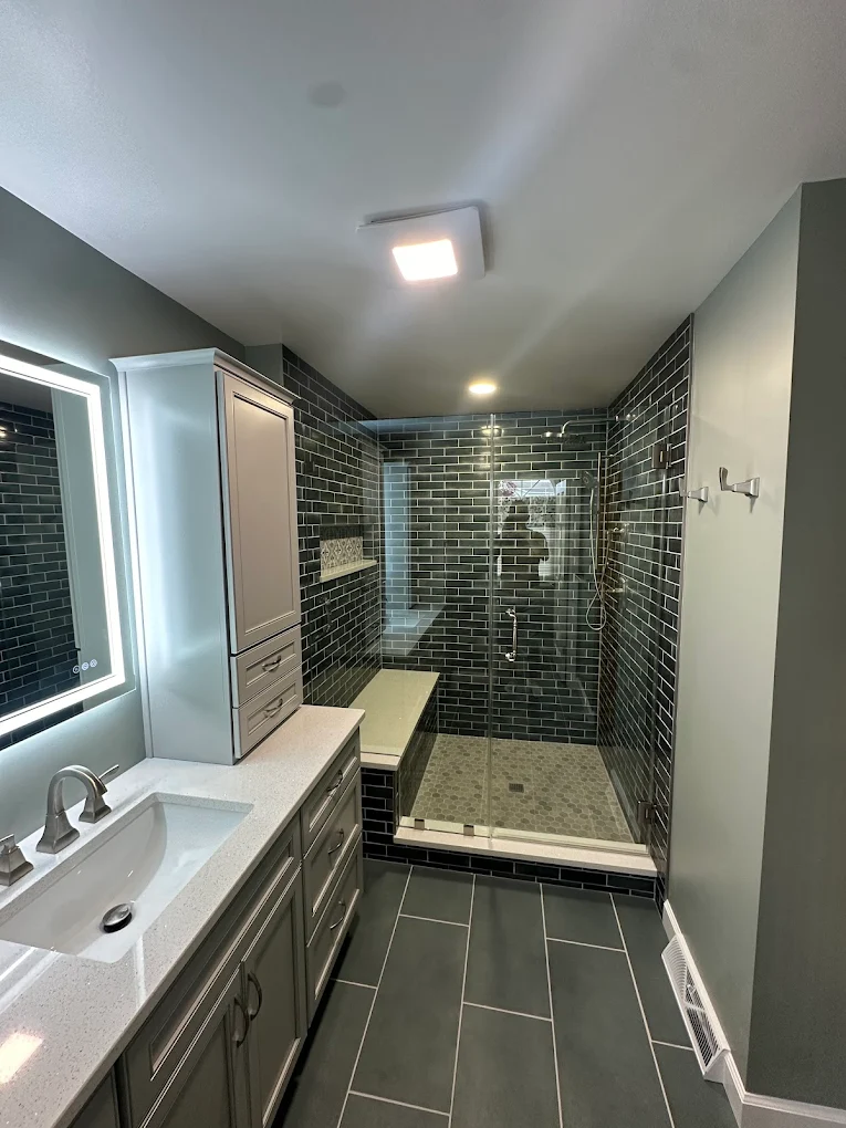 Modern Bathroom with Dark Blue Subway Tile Shower - Sireika Renovations