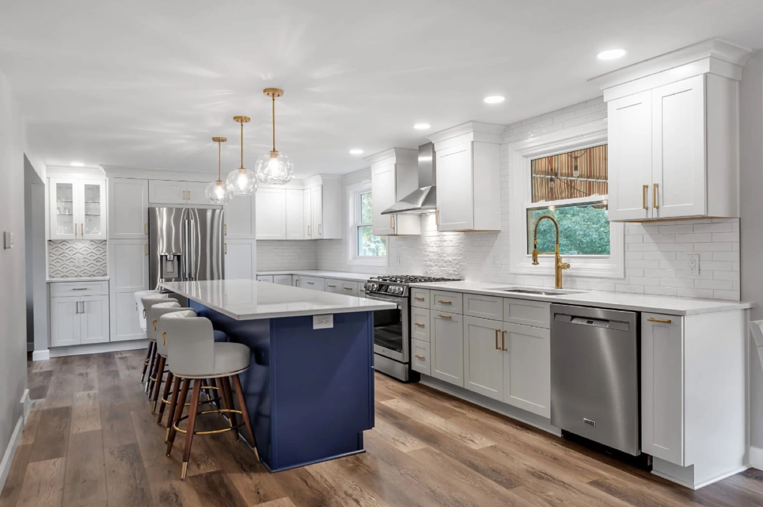 Modern White Kitchen with Navy Blue Island - Sireika Renovations LLC